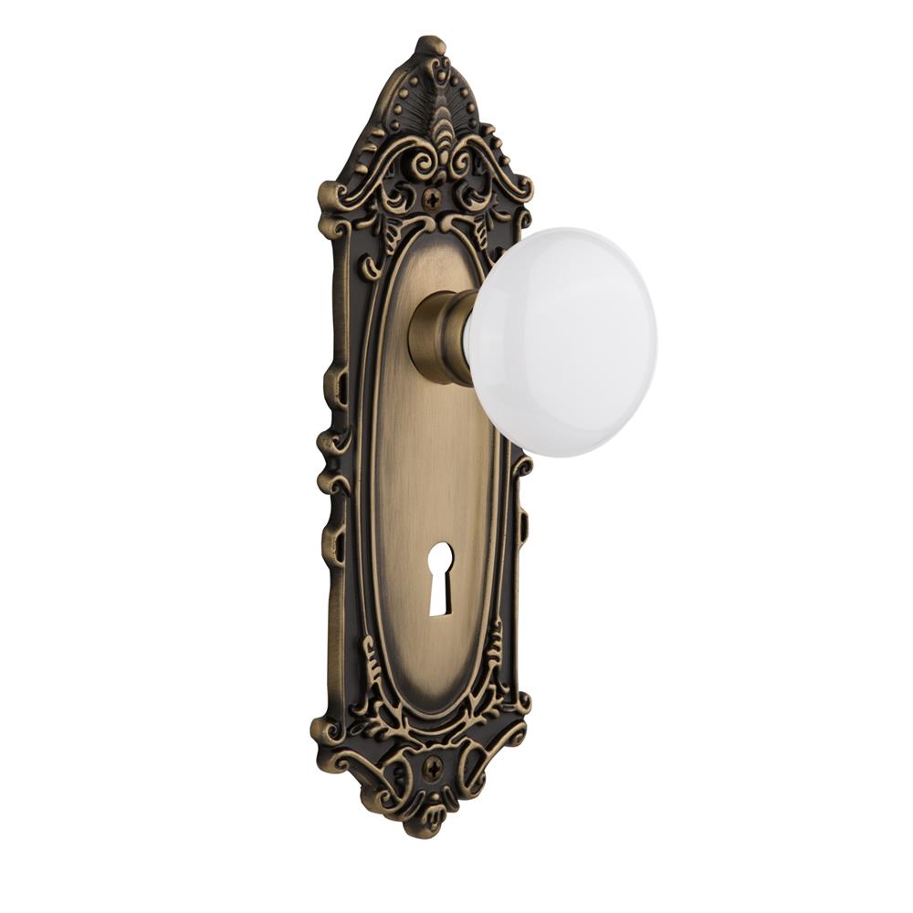 Nostalgic Warehouse VICWHI Mortise Victorian Plate with White Porcelain Knob and Keyhole in Antique Brass